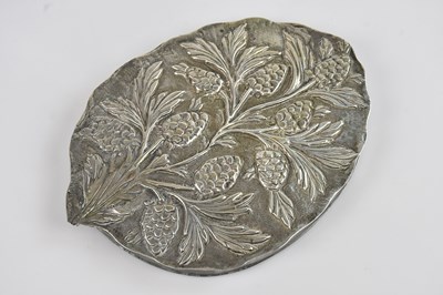 Lot 197 - An Eastern white metal decorative mirror with...
