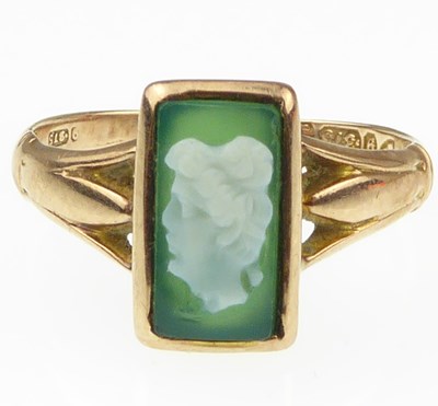 Lot 949 - A Victorian 9ct rose gold ring with green...