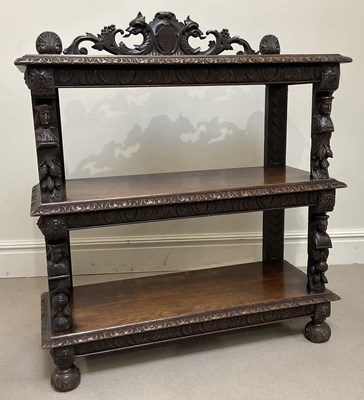 Lot 1085 - A Victorian carved oak three tier buffet,...