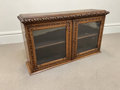 Lot 1120 - An early 20th century carved oak hanging wall...