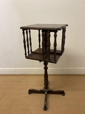 Lot 676 - A floor standing mahogany revolving book...
