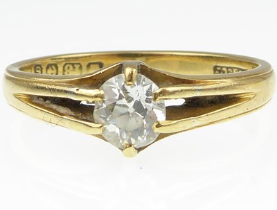 Lot 934 - An 18ct gold diamond solitaire ring, the claw...