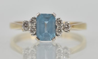 Lot 1231 - A 9ct yellow gold aquamarine and diamond dress...