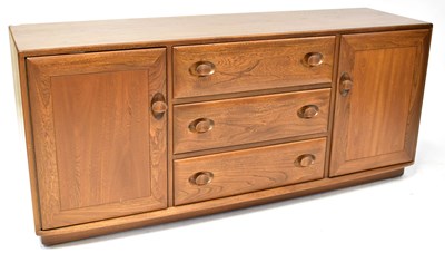 Lot 8 - ERCOL; a Windsor sideboard, comprising a pair...