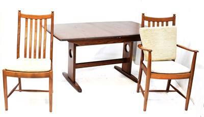 Lot 6 - ERCOL; a Windsor extending dining table on...