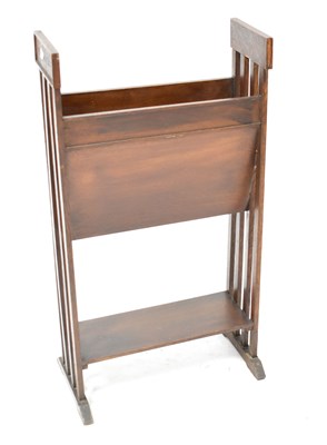 Lot 38 - An Arts and Crafts mahogany magazine rack on...