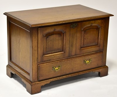 Lot 40 - A Georgian-style elm side table, with fall...