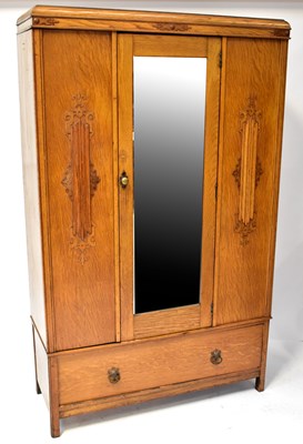 Lot 29 - A 1930s oak wardrobe with central mirrored...
