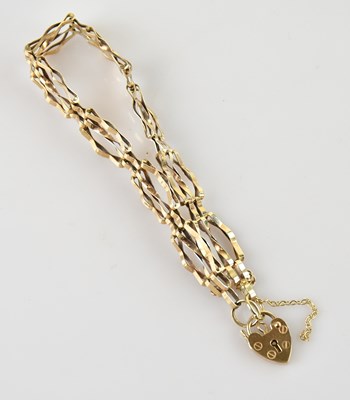 Lot 125 - A fine 9ct yellow gold gate link bracelet with...