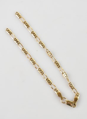 Lot 136 - A yellow metal fine link bracelet, stamped...