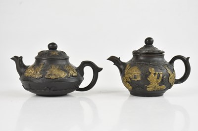 Lot 1371 - Two Chinese cast bronze teapots with relief...