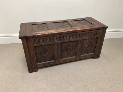 Lot 1087 - An 18th century carved oak blanket box, height...