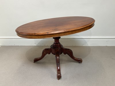 Lot 1101 - A Victorian mahogany table with carved column...