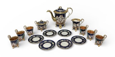 Lot 691 - CAPODIMONTE; a six setting porcelain cobalt...