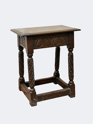 Lot 1058 - An 18th century style carved oak joint stool,...
