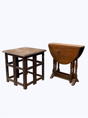Lot 1133 - A Burmese carved wood folding table, height...