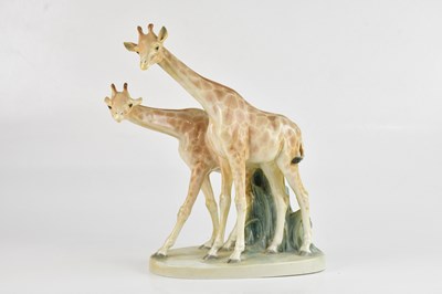 Lot 1386 - MEISSEN; a porcelain group of two giraffes,...