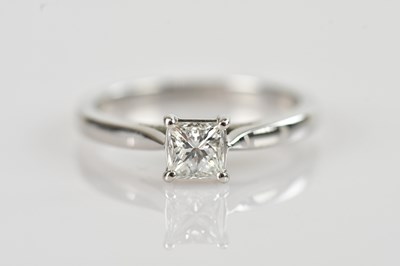 Lot 477 - A platinum diamond solitaire ring, the ripple...