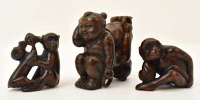 Lot 215 - Three carved boxwood netsukes, the largest...