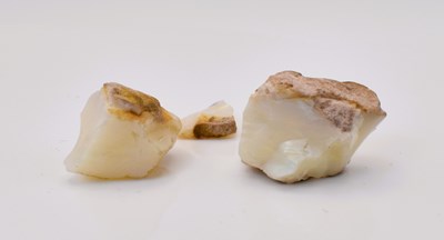Lot 618 - Three small pieces of loose cut opal,...