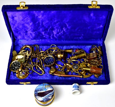 Lot 274 - A group of maritime-related brass keyrings,...