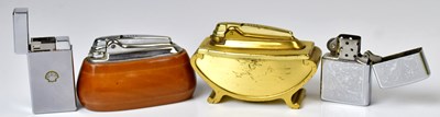 Lot 314 - Four vintage lighters, comprising a wooden...