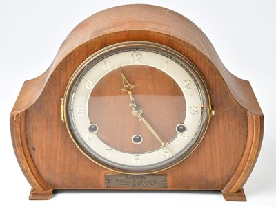 Lot 103 - A 1930s walnut cased mantel clock, the...