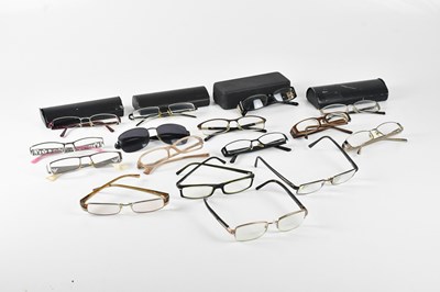 Lot 1243 - PRADA; eleven pairs of prescription glasses,...