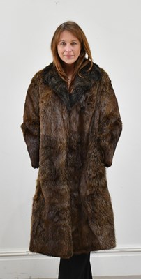Lot 1374 - A full-length marmot fur coat, fully lined,...