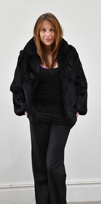 Lot 1376 - A short black rabbit fur jacket, size small.