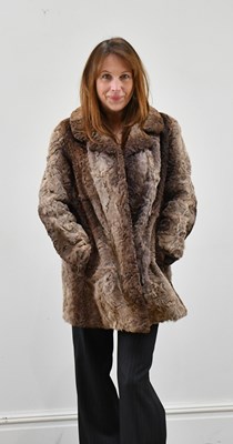 Lot 1377 - A short lambskin light and dark brown jacket,...