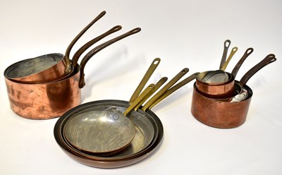 Lot 487 - A quantity of tin-lined copper pans with cast...