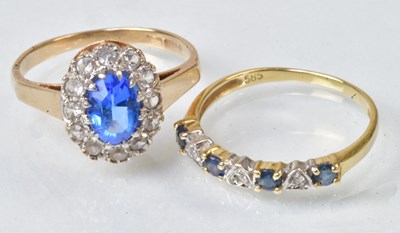 Lot 774 - A 14ct yellow gold ring set with four blue...
