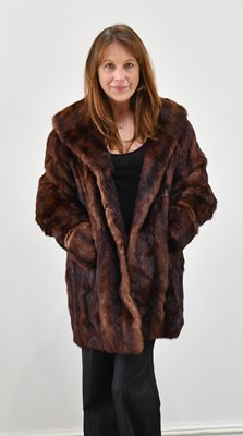 Lot 1386 - A full-length brown sheepskin coat with fox...
