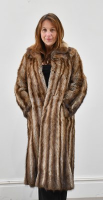 Lot 1388 - A full-length musquash fur coat with mink...