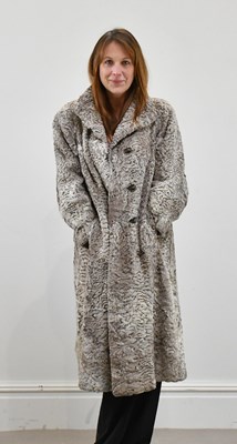 Lot 1390 - A full-length light brown Persian lamb coat,...