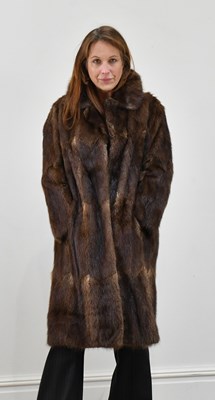 Lot 1366 - A full-length musquash fur coat.