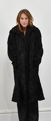 Lot 1373 - A black Persian lamb full-length coat.