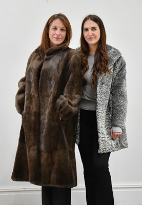 Lot 1347 - A dark brown full-length fur coat with classic...
