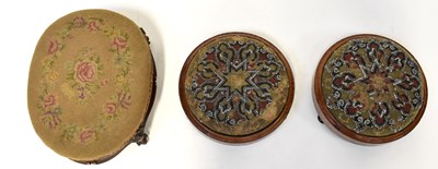 Lot 21 - A pair of inlaid walnut circular footstools...