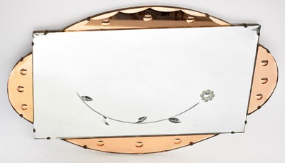 Lot 73 - A vintage wall mirror with peach glass...
