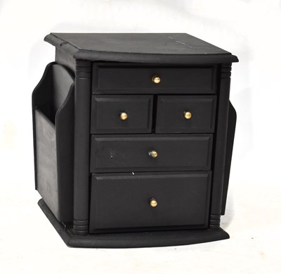 Lot 54 - A small black painted magazine caddy, with...