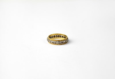 Lot 973 - A yellow and white gold ring set with small...