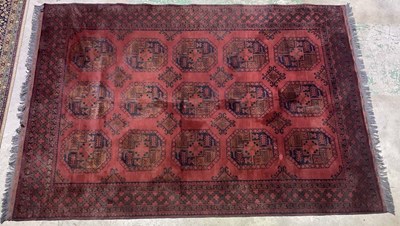Lot 693 - A machine woven Persian style rug, with hand...