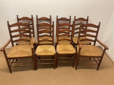 Lot 656 - Six oak ladder back chairs and two carvers,...