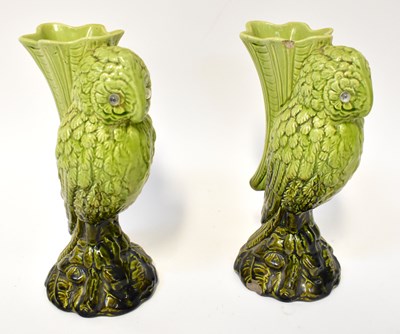 Lot 184 - A pair of green glazed Majolica owl vases,...