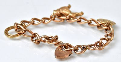 Lot 801 - A 9ct rose gold curb link bracelet, each link...