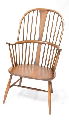 Lot 5 - ERCOL; a stained beech Windsor-type armchair,...