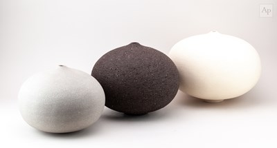 Lot 476 - RACHEL PETERS; a graduated trio of white,...