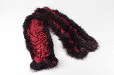 Lot 1288 - ETRO; a burgundy red silk gathered stole,...